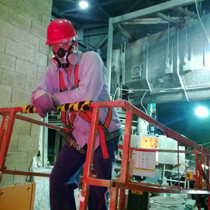 Industrial Vacuum System Showing Correct PPE in a Smelting Room